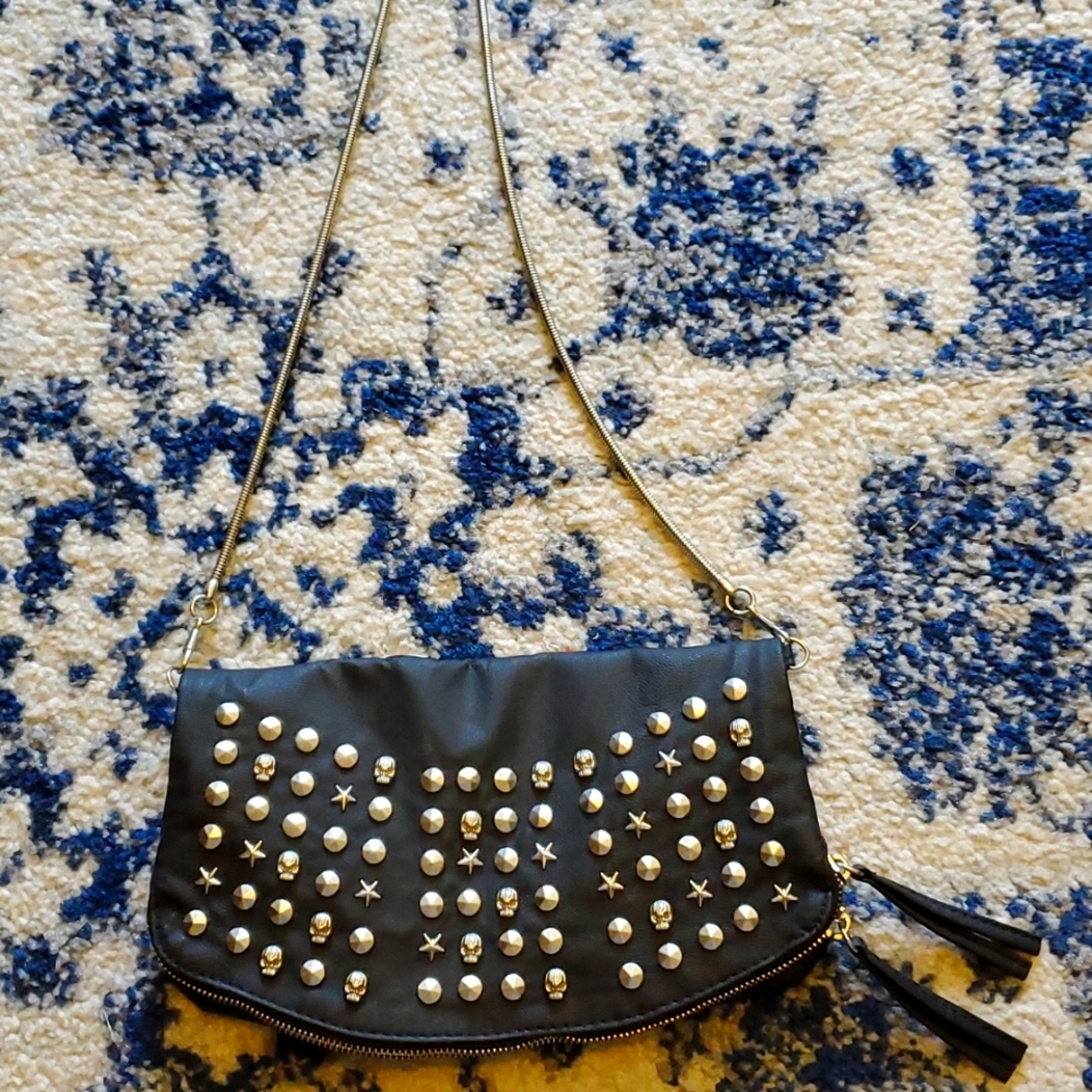 Skull and star studded handbag